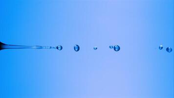 une laissez tomber de liquide descend de une pipette sur un électrique bleu surface, ressembler une petit cercle. le macro la photographie capture le moment dans étourdissant détail video