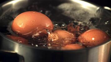 Super slow motion in the pan boiled eggs with air bubbles. Macro background. Filmed on a high-speed camera at 1000 fps. video