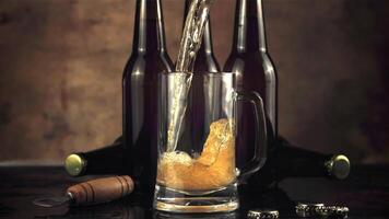 Super slow motion fresh beer pours jet into the glass. On a brown background.Filmed on a high-speed camera at 1000 fps. video