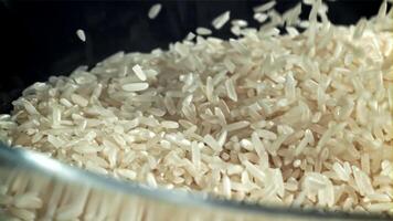 The grains of rice fall into the pot. Filmed on a high-speed camera at 1000 fps. High quality FullHD footage video