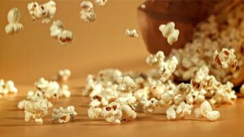 Popcorn falls on the table. Filmed on a high-speed camera at 1000 fps. High quality FullHD footage video