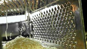 The cheese is grated. Filmed on a high-speed camera at 1000 fps. High quality FullHD footage video