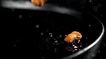 Drop pickled mushrooms with splashes. Filmed on a high-speed camera at 1000 fps. High quality FullHD footage video