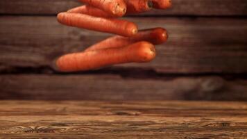 Falling carrots on the table. Filmed is slow motion 1000 fps. High quality FullHD footage video