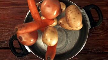 Vegetables fall into the pan. Filmed is slow motion 1000 fps. High quality FullHD footage video