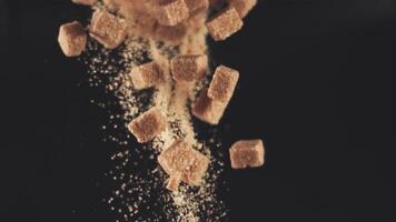 Super slow motion drop pieces of cane sugar on a black background. Filmed on a high-speed camera at 1000 fps. High quality footage. video