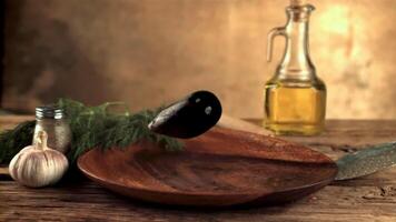 Super slow motion mussels fall into a wooden plate on the table. On a brown background.Filmed on a high-speed camera at 1000 fps. video