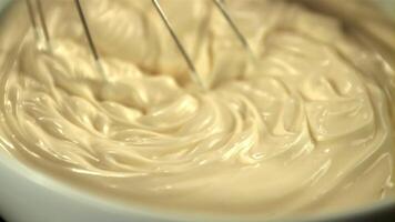 Super slow motion homemade mayonnaise stirred with a whisk in the bowl. Macro background. Filmed on a high-speed camera at 1000 fps. video