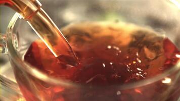 Super slow motion black tea is poured into the cup. Macro background.Filmed on a high-speed camera at 1000 fps. video