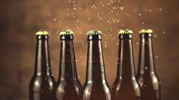 Super slow motion on glass beer bottles drops water. On a brown background. Filmed on a high-speed camera at 1000 fps. video