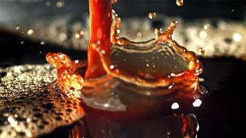 A stream of black coffee with splashes. Filmed on a high-speed camera at 1000 fps. High quality FullHD footage video