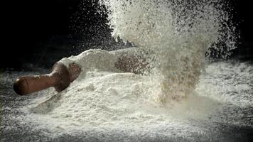 Flour falls on the kitchen table. Filmed on a high-speed camera at 1000 fps. High quality FullHD footage video