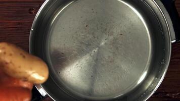 Potatoes fall into the pan. Filmed is slow motion 1000 fps. High quality FullHD footage video