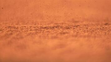 Super slow motion cocoa powder pours into a heap. Macro background. Filmed on a high-speed camera at 1000 fps. video