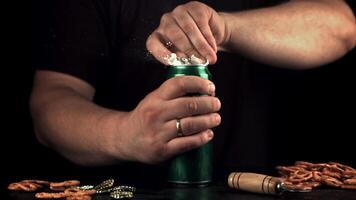 Super slow motion men's hands open a tin of beer. On a black background.Filmed on a high-speed camera at 1000 fps. video