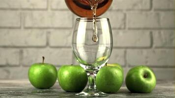 Super slow motion apple juice is poured from jug into a glass. On a white background.Filmed on a high-speed camera at 1000 fps. video