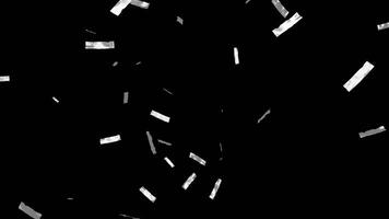 Falling shiny silver confetti isolated on transparent black background video