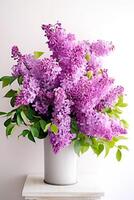A bouquet of beautiful lilacs in a vase. . photo