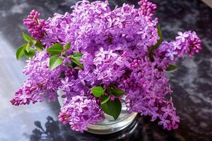 A bouquet of beautiful lilacs in a vase. . photo