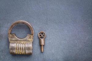vintage screw type iron padlock photo