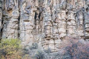 sandstone cliff with columns and pillars photo