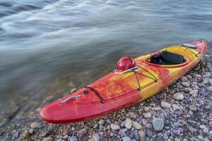whitewater kayak with helmet photo