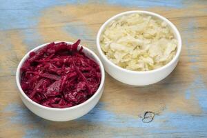 bowls of organic, red beets and cabbage kraut photo