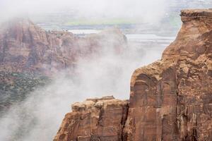 sandstone formations in fog photo