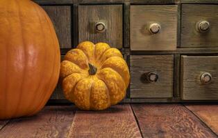 primitive grunge drawer cabinet with pumpkin photo