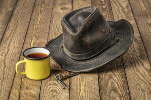 weathered outback oilskin hat on barn wood photo