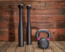 pair of heavy steel Indian clubs and kettlebell photo