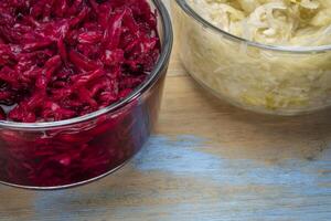 bowls of organic, red beets and cabbage sauerkraut photo