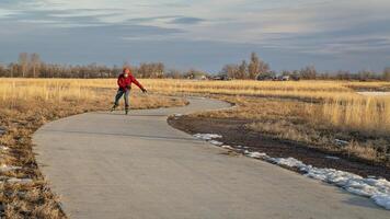 inline skating on a paved bike trail in Colorado photo