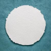 circular sheet of blank white watercolor paper photo