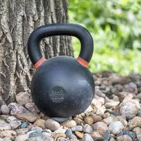 heavy iron kettlebell in a backyard photo