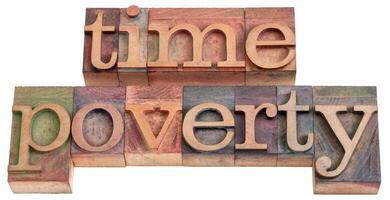 time poverty word abstract in wood type photo