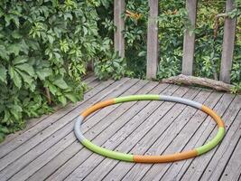 weighted hula hoop on a backyard deck photo