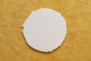 circular sheet of blank white watercolor paper photo