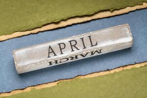 April text on grunge wooden block photo