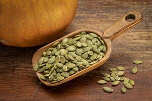 scoop of pumpkin seeds photo