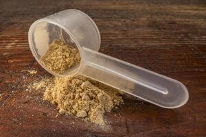 scoop of maca root powder photo