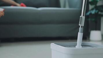 Woman cleaning table using rag and diffuser at home. video