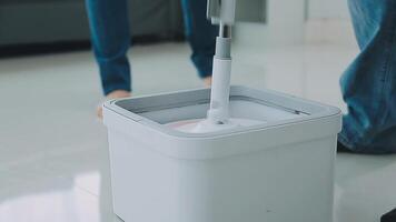 Woman cleaning table using rag and diffuser at home. video