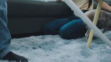 Woman cleaning table using rag and diffuser at home. video