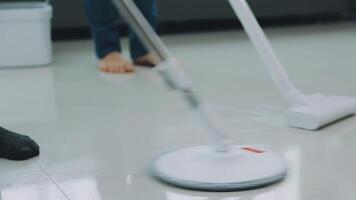 Woman cleaning table using rag and diffuser at home. video