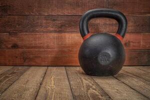 iron kettlebell on a rustic wood photo