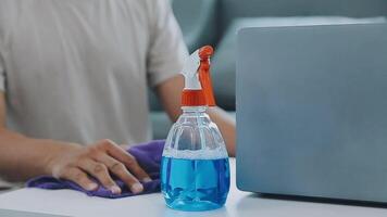 Woman cleaning table using rag and diffuser at home. video