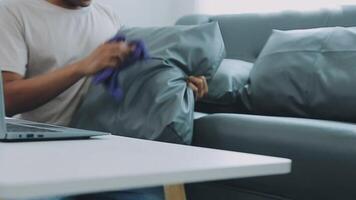 Woman cleaning table using rag and diffuser at home. video