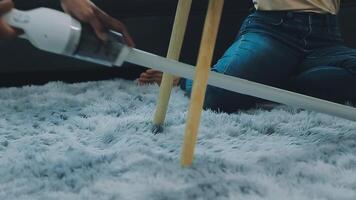 Woman cleaning table using rag and diffuser at home. video