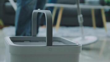 Woman cleaning table using rag and diffuser at home. video